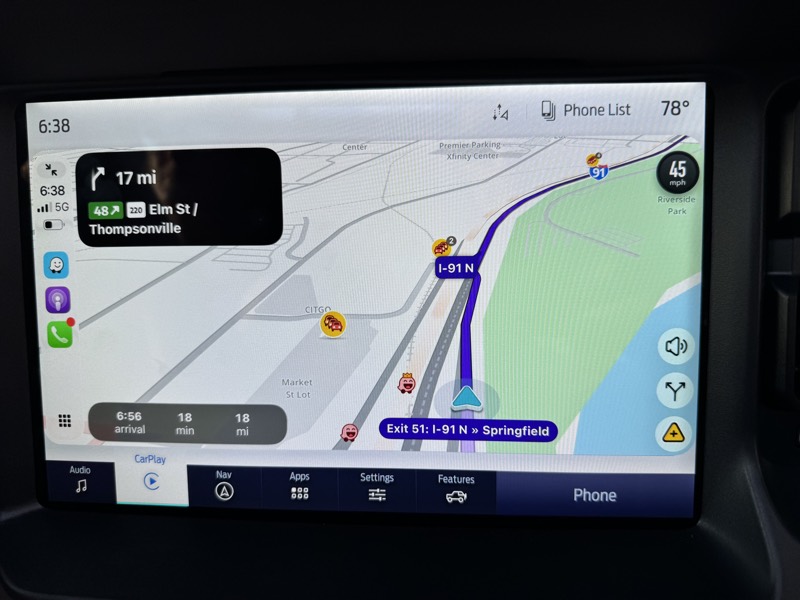 A car screen running Waze on I-91 north, eighteen miles from the warehouse in Enfield.
