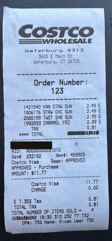 The food court receipt, with the card number blacked out.
