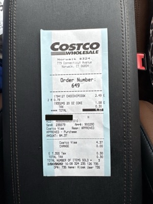 The food court receipt from warehouse 324, with the card number blacked out.