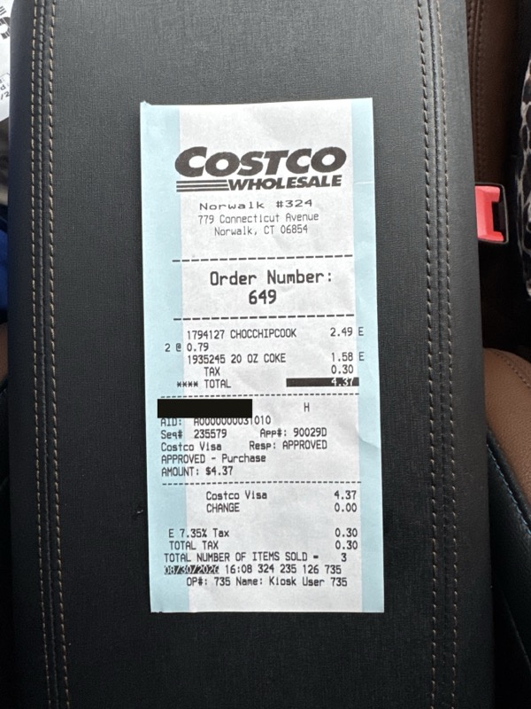 The food court receipt, with the card number blacked out.
